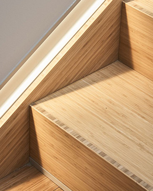 Close up detail of smooth laminated bamboo stair tread edge finishing